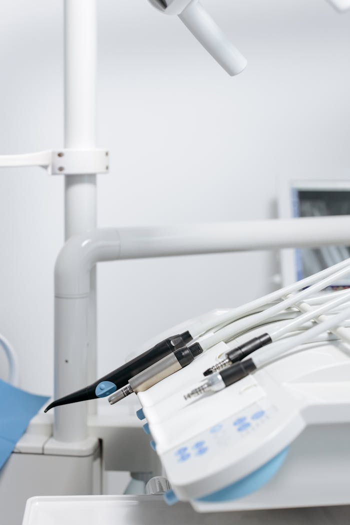 hero-img-01 Sterile dental equipment and tools in a modern clinic setting, ready for dental care procedures.